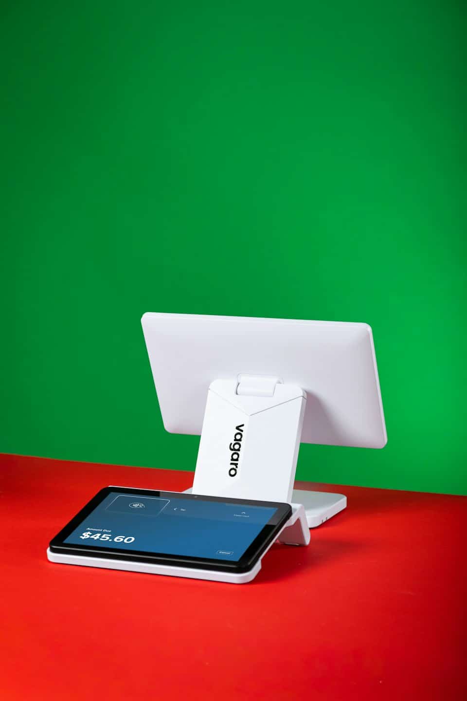 A white point of sale system displays transaction screens.